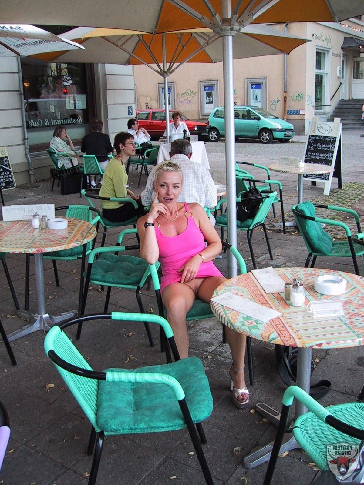 Blonde girl in pink going commando