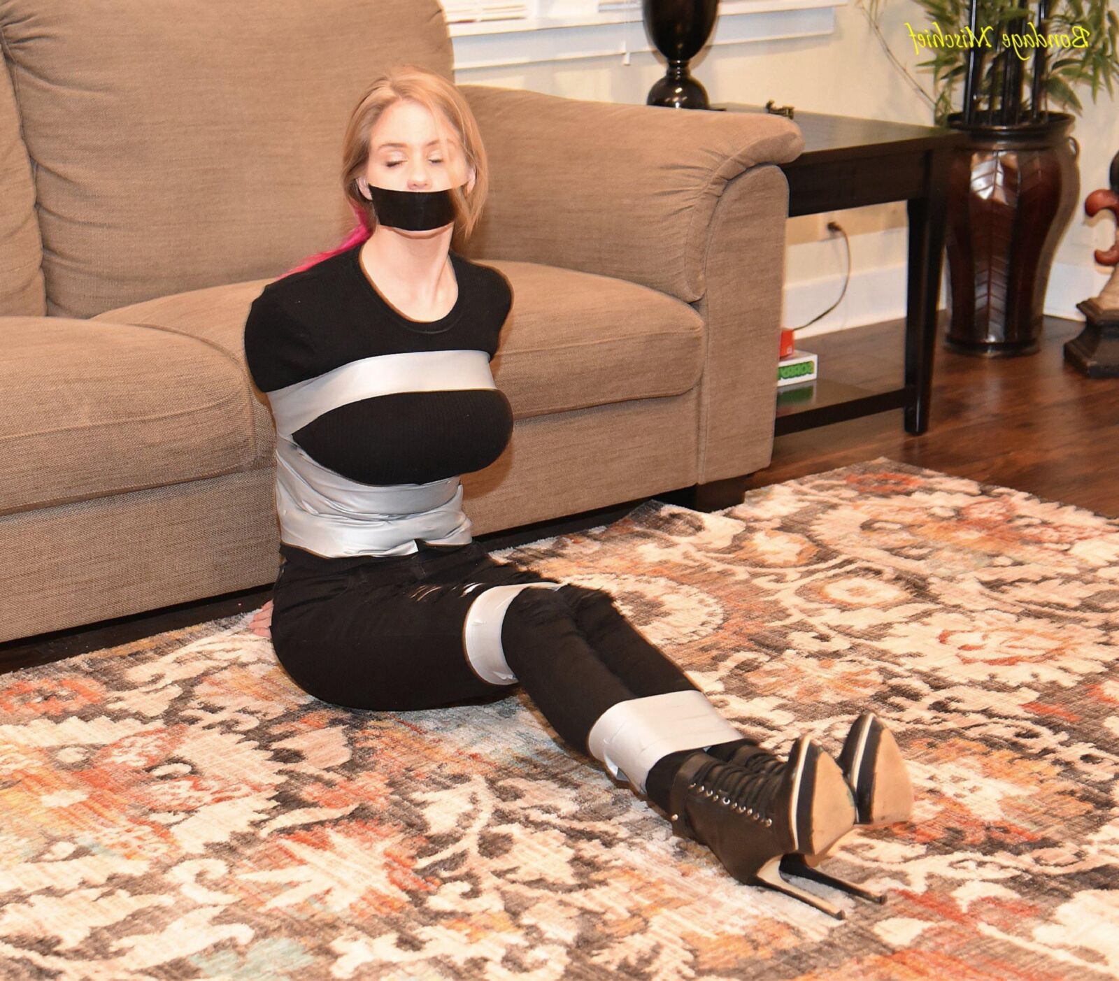 Anabelle Pync Black clothes & Silver tape